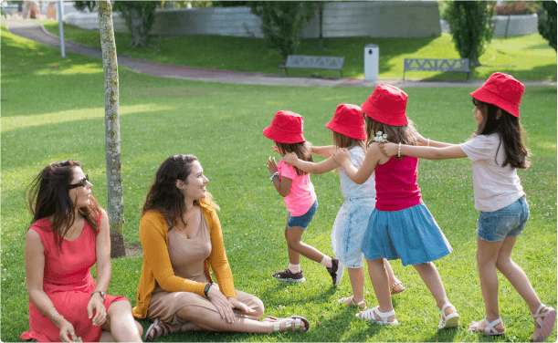 Children and teachers spending time together outdoors