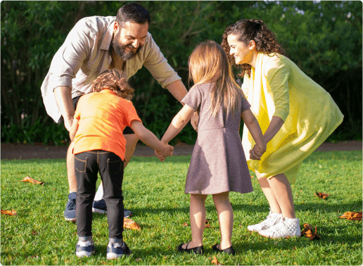 Adults and children enjoying an outdoor activity together